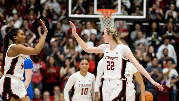 Feb 20, 2023; Stanford, California, USA; Stanford Cardinal forward Cameron Brink (22) and forward Kiki Iriafen (44) celebrate their 71-66 victory over UCLA Bruins at Maples Pavilion. Mandatory Credit: John Hefti-USA TODAY Sports